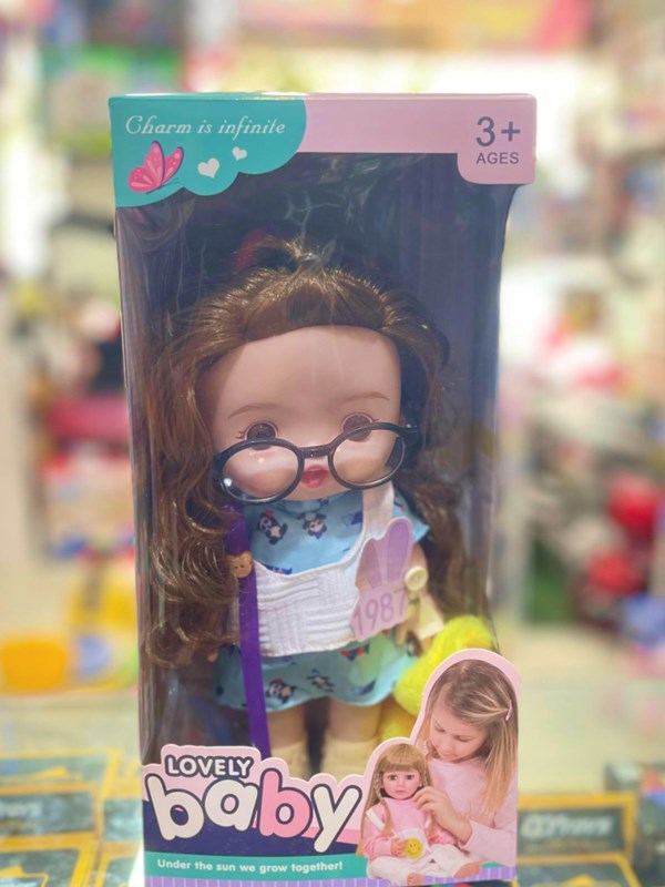 عروسک دختر عینکی موزیکال 27 سانتی گوشتی با کلاه زرد کد 12_اسباب بازی